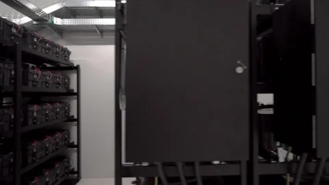 Back side of working data servers with flashing LED lights Stock Footage 169477738