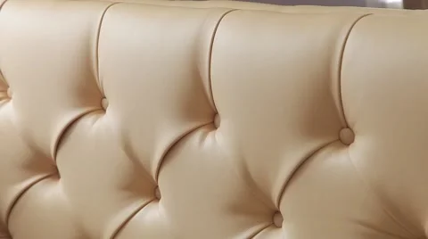 The back of the sofa covered with the skin with nails in vintage style Stock Footage 55617486