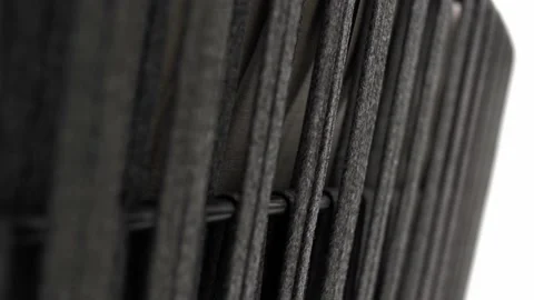 Back of the sofa is made of a frame and black ropes woven together. Video stock 220218508
