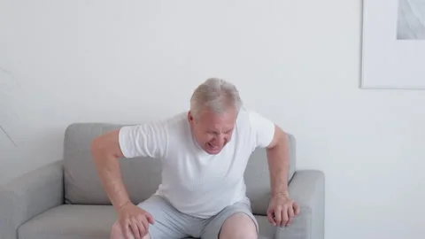 Back spasm spine cramp senior man backache pain Stock Footage 197104487