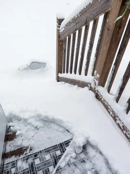 Back stairs covered with snow during snowstorm in winter Stock Photos