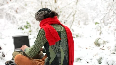 Back of stylish freelance man using laptop computer enjoying beautiful winter 스톡 동영상 166955298