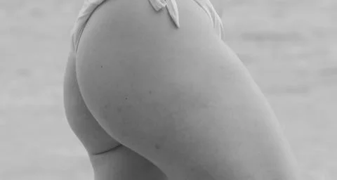 The back of the swimsuit with the buttocks of the model. Black and white phot Stock Photos