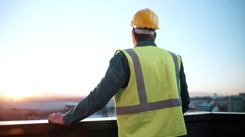 Back, thinking and engineer on balcony for construction, inspection and planning Stock Footage 337925220