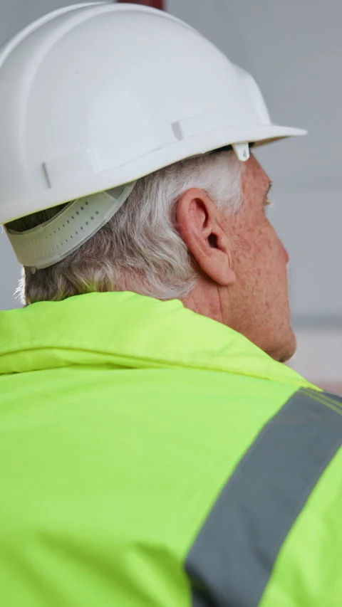 Back, thinking and man with helmet for construction, renovation project and Stock Footage 342323691