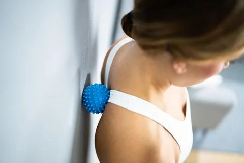 Back Trigger Point Massage Using Spiky Ball Stock Photos