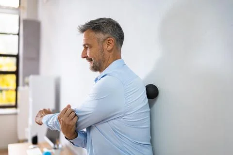 Back Trigger Point Massage Using Foam Ball Stock Photos