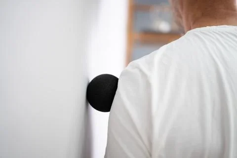 Back Trigger Point Massage Using Foam Ball Stock Photos