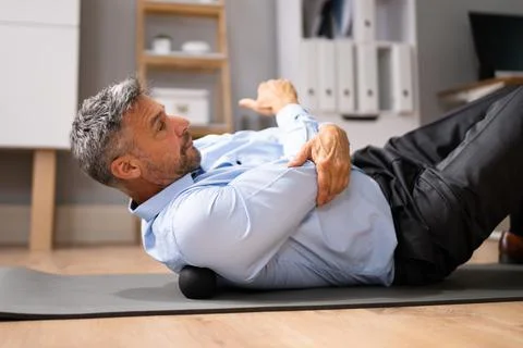 Back Trigger Point Massage Using Foam Ball Stock Photos