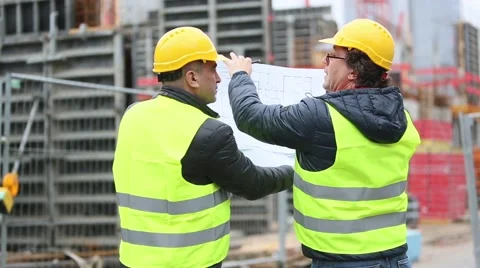 Back turned engineer and technician on a construction site Stock Footage 58059774