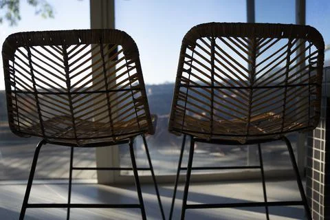 Back of two wicker chairs side by side Stock Photos