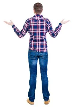 Back view of angry young man in jeans and checkered shirt Foto stock