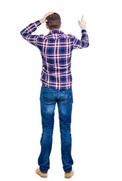 Back view of angry young man in jeans and checkered shirt Stock Photos