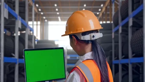 Back View Of Asian Female Engineer Working On A Green Screen Laptop Tire Stock Footage 341789589