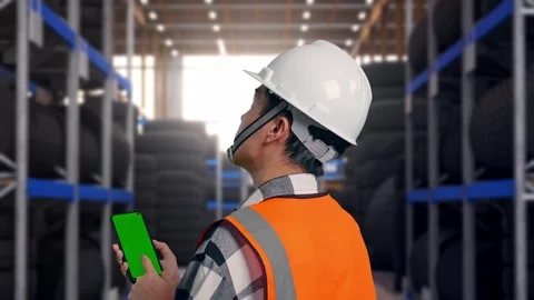 Back View Of Asian Male Engineer Working On A Green Screen Smartphone Tire Stock Footage 341787372