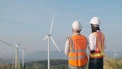 Back view of asian man and woman engineer team working. Video stock 221577063