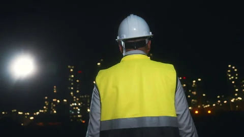 Back view of Asian man engineer working with tablet and walkie talkie. Stock Footage 270461380