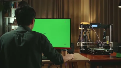 Back View Of Asian Man Work On 3D Printer And Personal Computer With Mock Up Stock Footage 158106816