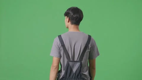 Back View Of Asian Man Worker Walking And Looking Around In The Green Screen Stock Footage 253467376
