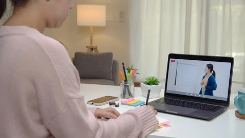 Back view of asian student learning education online at home. 스톡 동영상 129845245