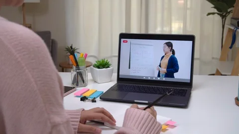Back view of asian student learning education online at home. 스톡 동영상 129845871