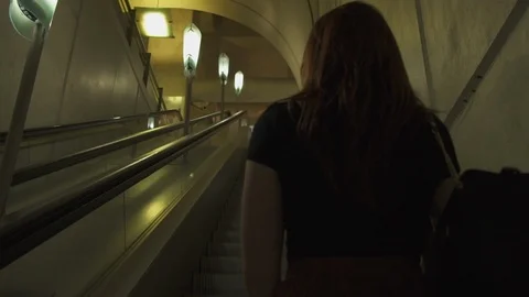 Back view of attractive caucasian redhead woman, black jacket and red hair on Video stock 119363335