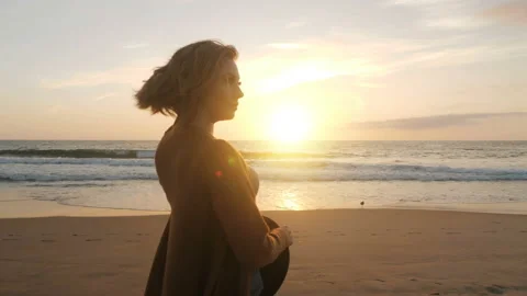 Back view attractive female posing on beach at sunset medium shot travel girl Stock Footage 126901764