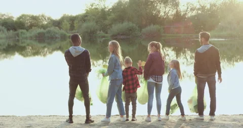 Back view of attractive happy satisfied diverse nature activists which standing Stock Footage 140728689