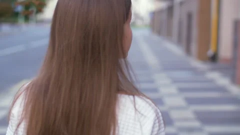 Back view of attractive long-haired curly brunette woman Stock Footage 140361911