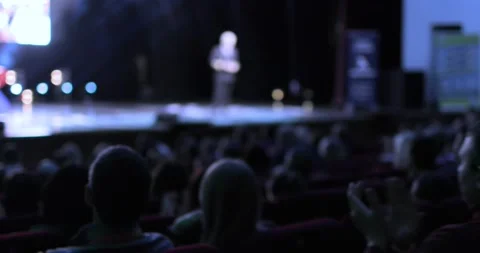 Back view of an audience sitting at a business conference. A camera is moving Stock Footage 168291149