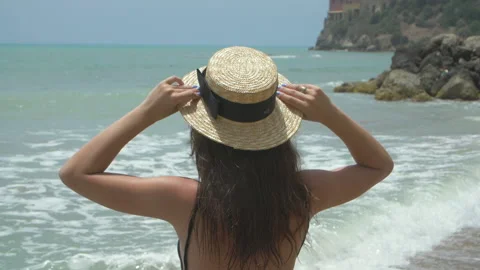Back view of beautiful brunette model  on tropical beach Stock Footage 140164261