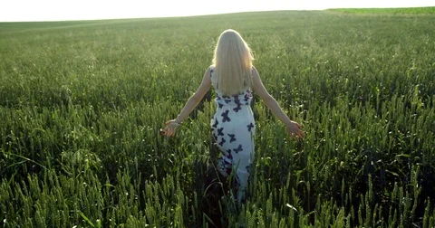 Back view of the beautiful young blonde smiling woman with natural make-up Stock Footage 84797973