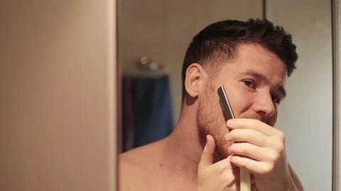 Back view from behind male reflection in mirror in bathroom naked young man Stock Footage 278292704