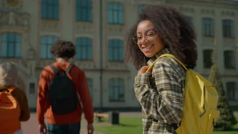 Back view from behind multiracial friends students three girls female women boy Video stock 290388516