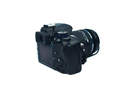 Back view of a black colored digital camera with a nice lens attached to it o Stock Photos