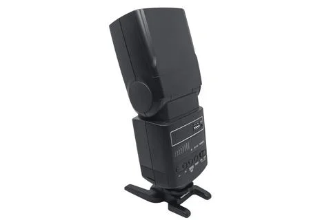 A back view of a black external camera flash speedlight showing the control.. Stock Photos