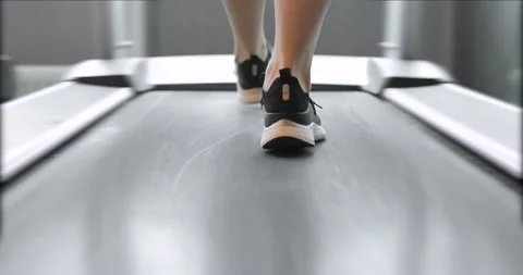 Back view of black shoes having workout on treadmill. Closeup Stock-Footage 153219797
