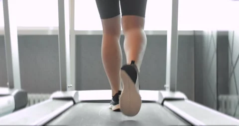 Back view of black shoes having workout on treadmill. Stock Footage 153220090