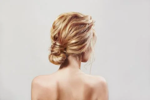 Back view of blondi woman with long hair Stock Photos