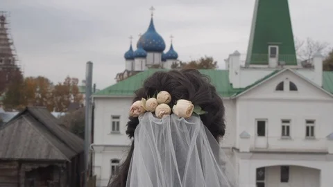 Back view of bride in ancient Russian city Stock Footage 120087803