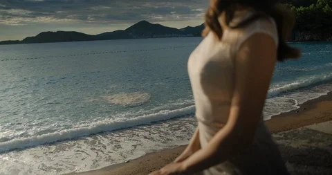 Back view of bride in dress looking at the sea in Montenegro Stock Footage 126775844