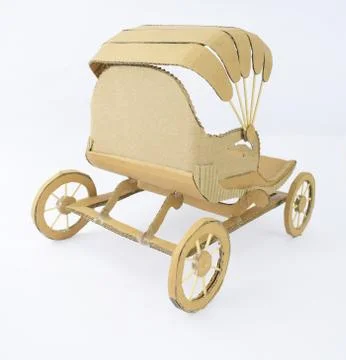 Back view of a brown colored carriage made of recycled card-board displayed o Stock Photos
