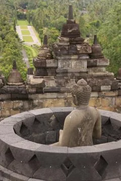 Back view of buddha statue in stupa at Borobudur Stock Photos