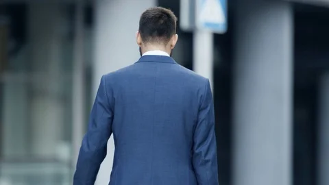 Back View of the Business Man in a Tailored Suit Walking on the Street. Stock Footage
