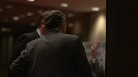 Back view of businessmen talking Stock Footage 34437872