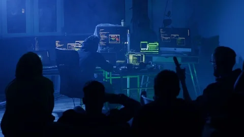 Back view of busy skillful hacker breaking and infecting servers with viruses in Video stock 108826685