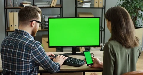 Back view on the Caucasian man taping on the laptop computer and woman next to Stock-Footage 89950822