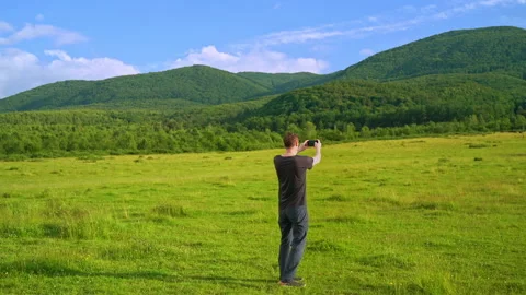 Back view caucasian man using smartphone Stock Footage 142719649