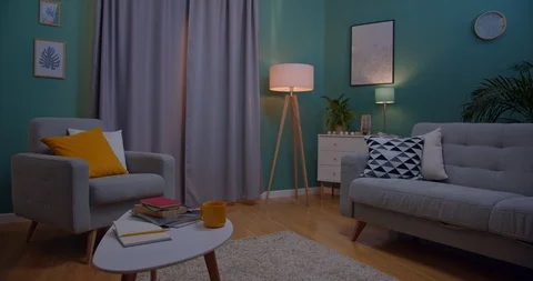 Back view on the Caucasian red-haired young woman coming to the window early in Stock Footage 122498757