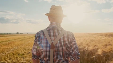 Back view on the Caucasian senior man in the hat standing and stepping the Stock Footage 113295655